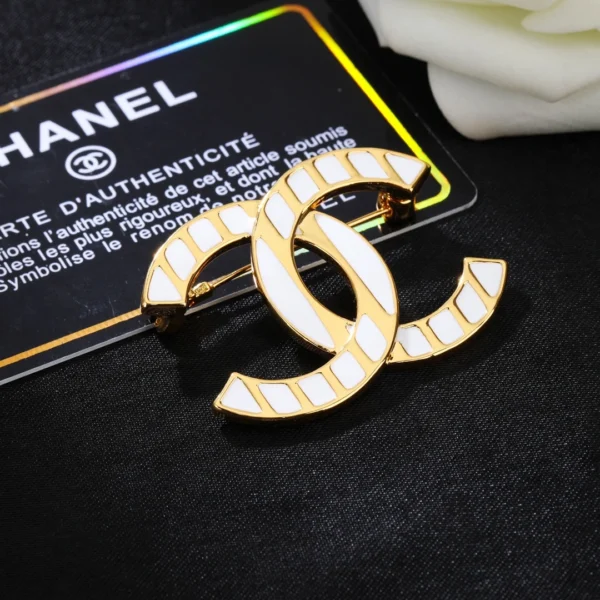 Replica Chanel CC style white gold striped brooch